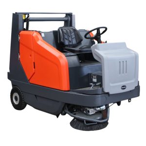 A ride-on floor sweeper machine with a black seat, steering wheel, orange and gray body, and visible cylindrical brush underneath—explore used floor sweepers for sale for affordable cleaning solutions.